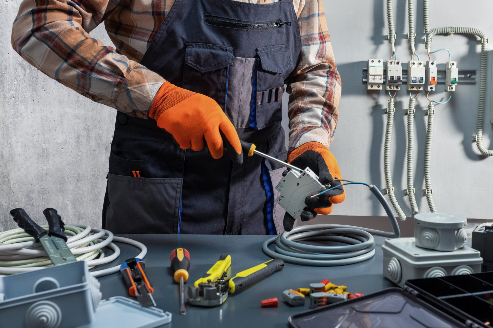 Electrician working with power switch